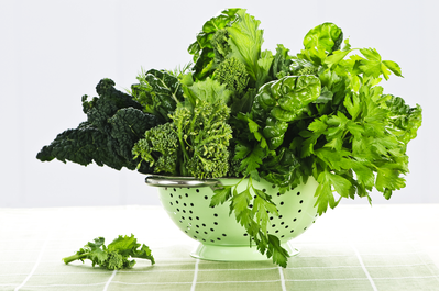 colander full of leafy greens