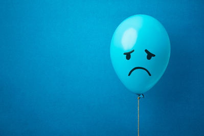 blue balloon with sad face